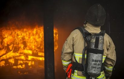 Firefighter putting out fire