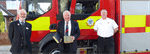 Councillor angus ross, air commodore rick peacock edwards and che scott in front of fire engine