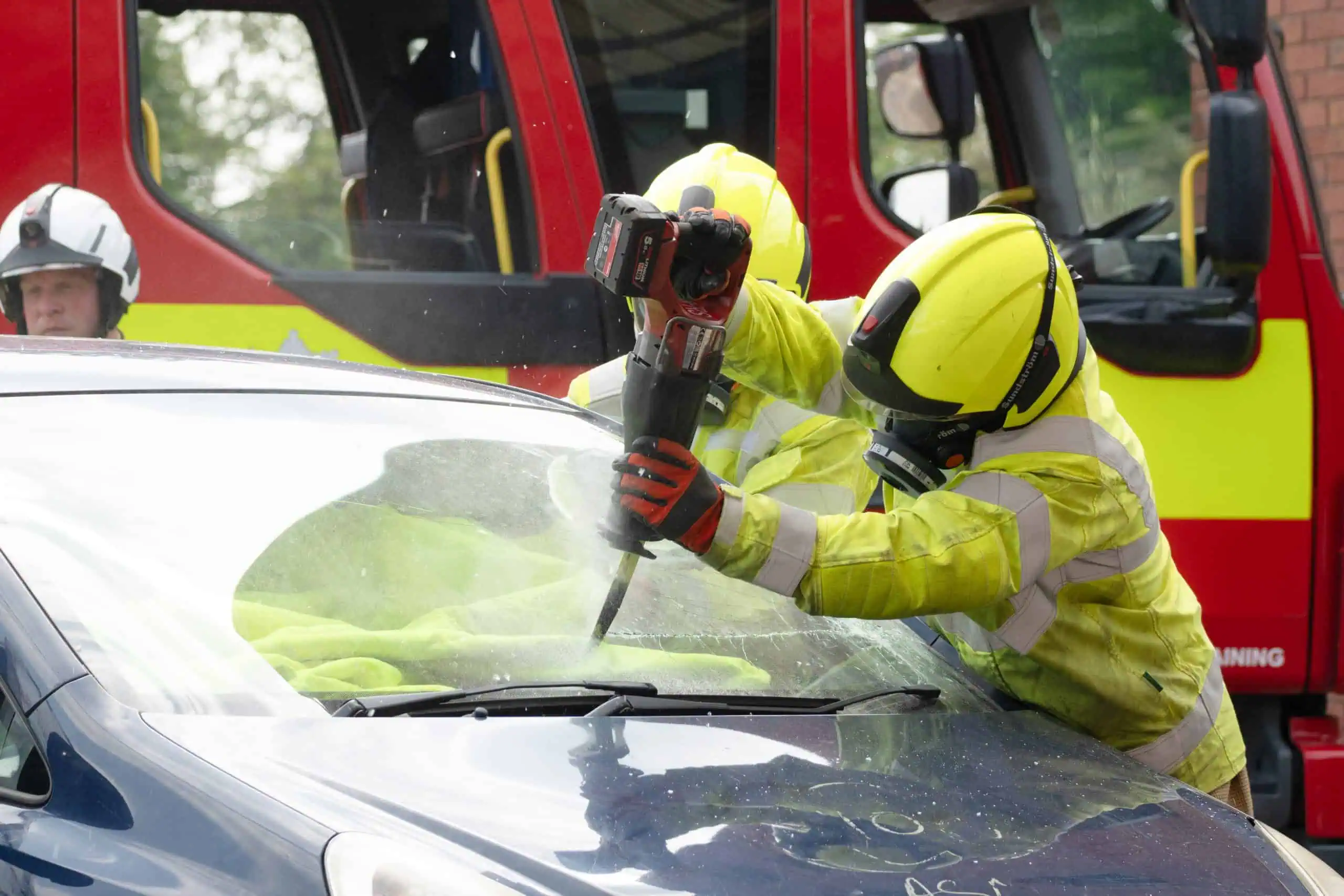 Firefighters cutting a car in a RTC demonstration.