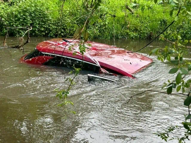 A car submerged in water in Land's End Ford, Twyford