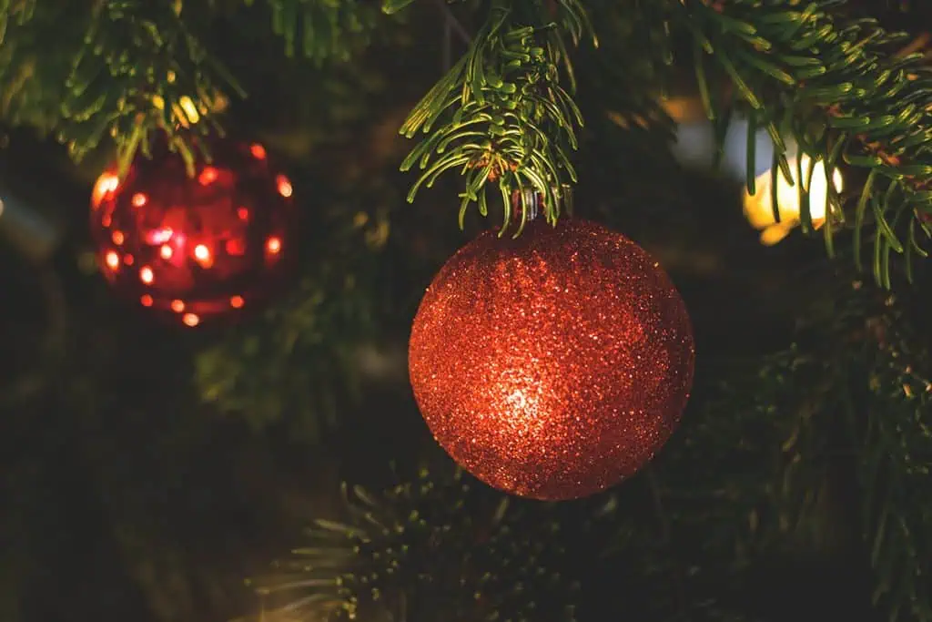 Close up of Christmas baubles on a tree.